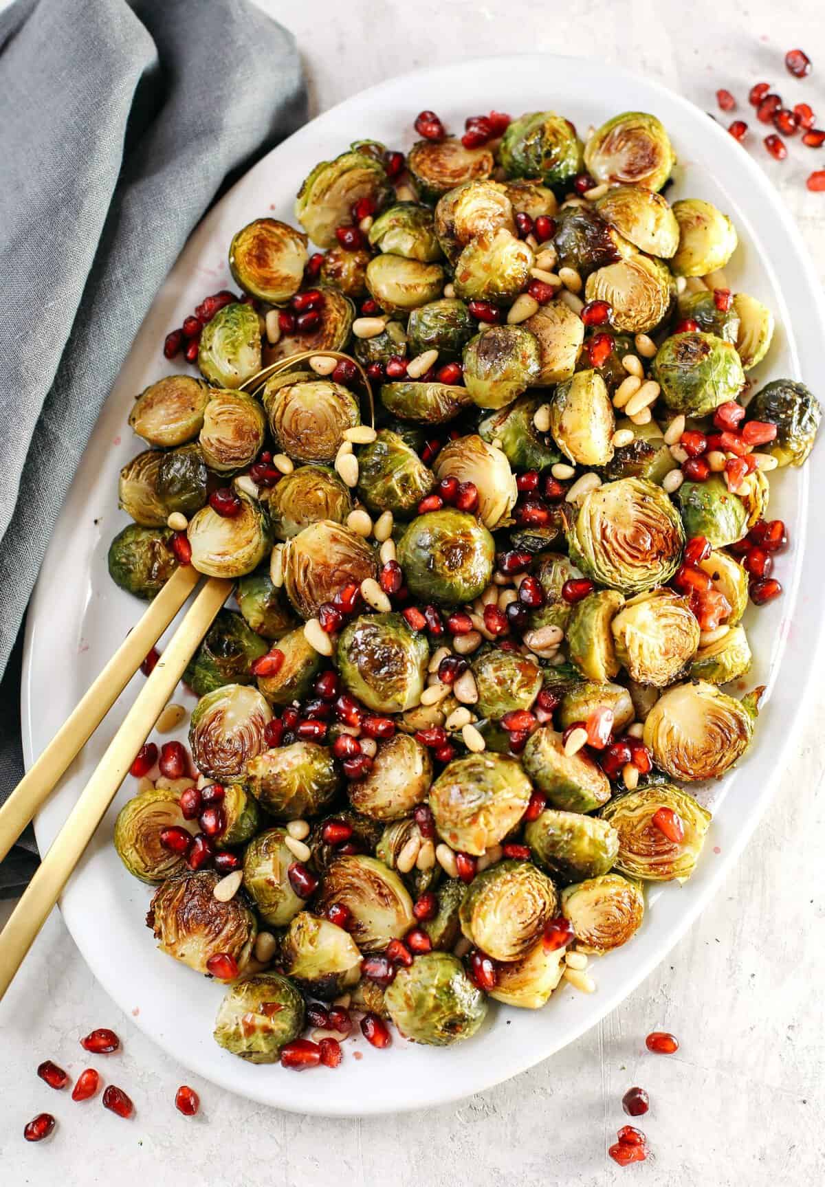 These Pomegranate Glazed Brussels Sprouts are savory, sweet and roasted to perfection making them the perfect holiday side dish for your table this season!