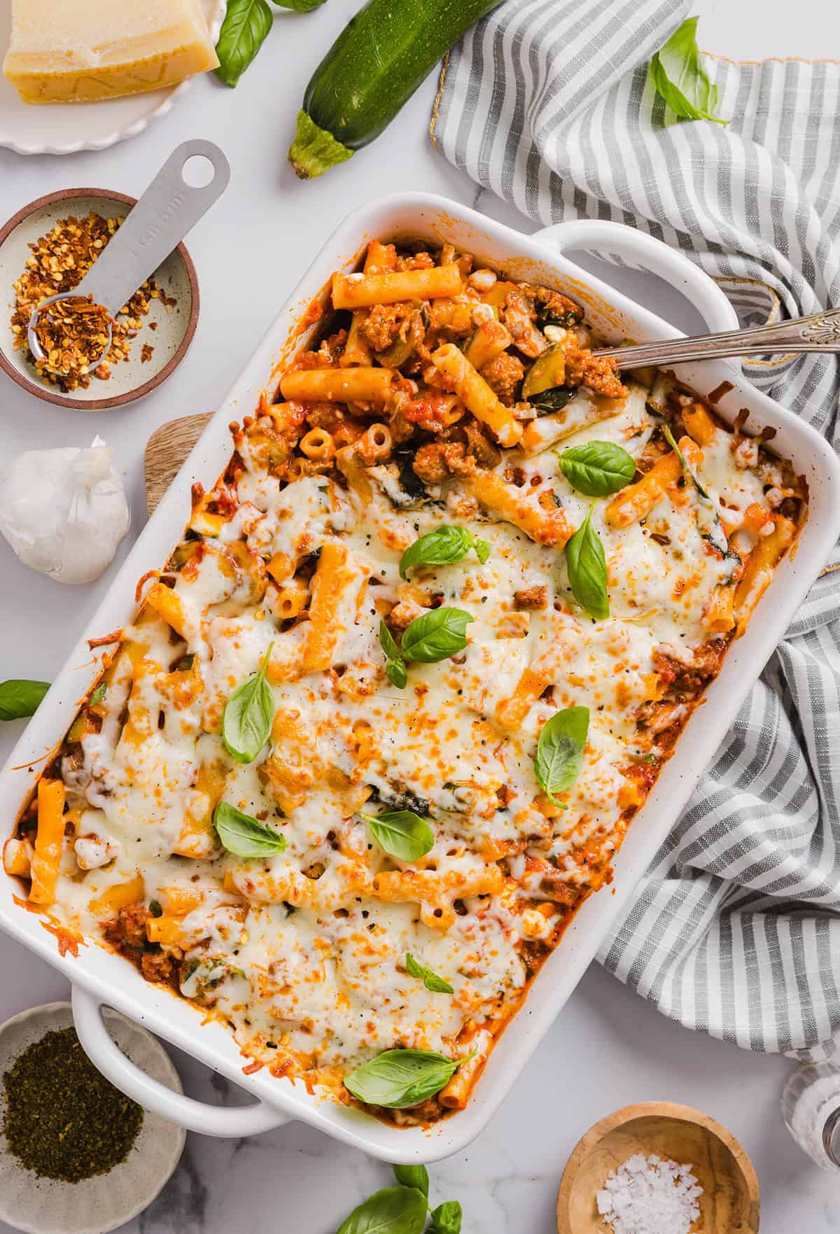 Comforting and delicious Healthy Baked Ziti packed with veggies, flavorful turkey sausage and makes the perfect weeknight meal the whole family will love! Leftovers guaranteed!