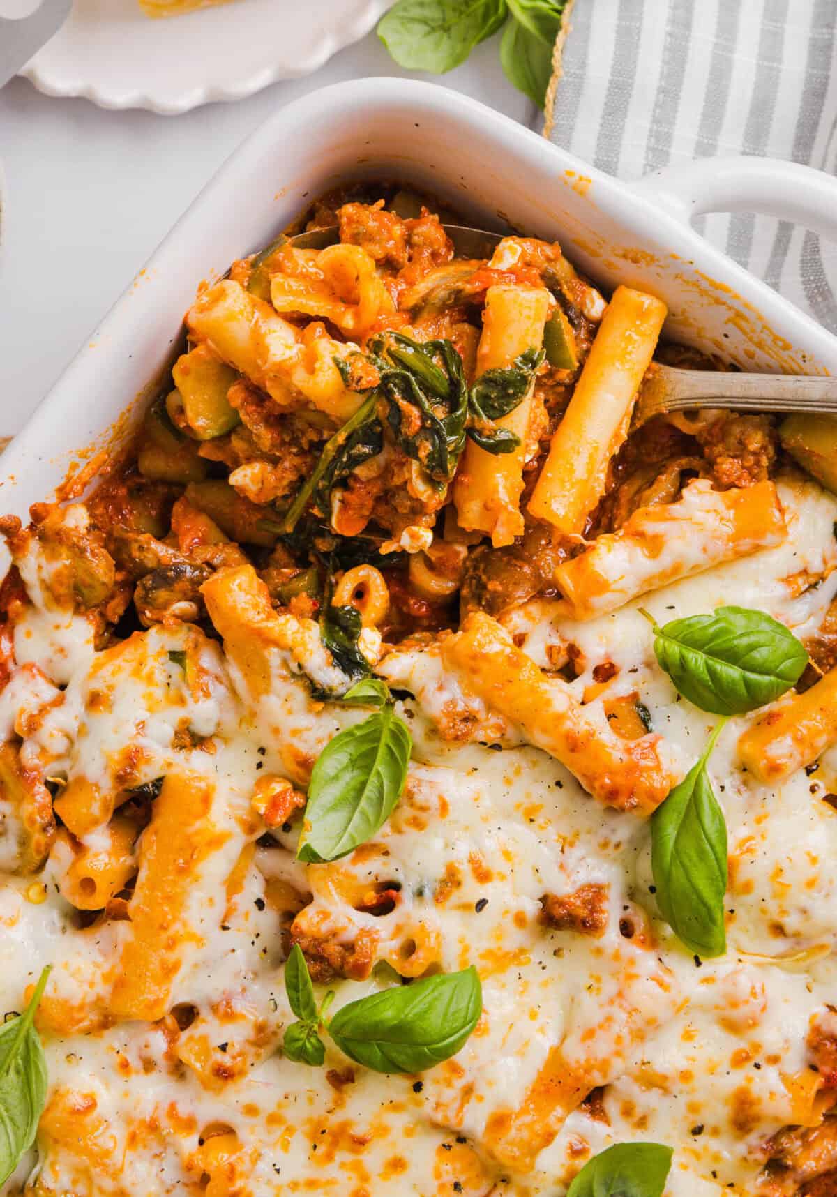 This comforting and delicious Healthy Baked Ziti recipe is packed with fresh veggies, flavorful turkey sausage and makes the perfect weeknight meal the whole family will love! Leftovers are guaranteed!