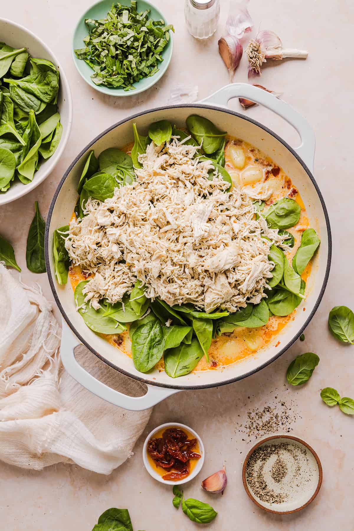 This EASY One Pan Marry Me Chicken and Gnocchi is the perfect weeknight meal! Pillowy soft gnocchi and tender chicken simmered together in a creamy sun dried tomato and parmesan sauce in just 20 minutes!  