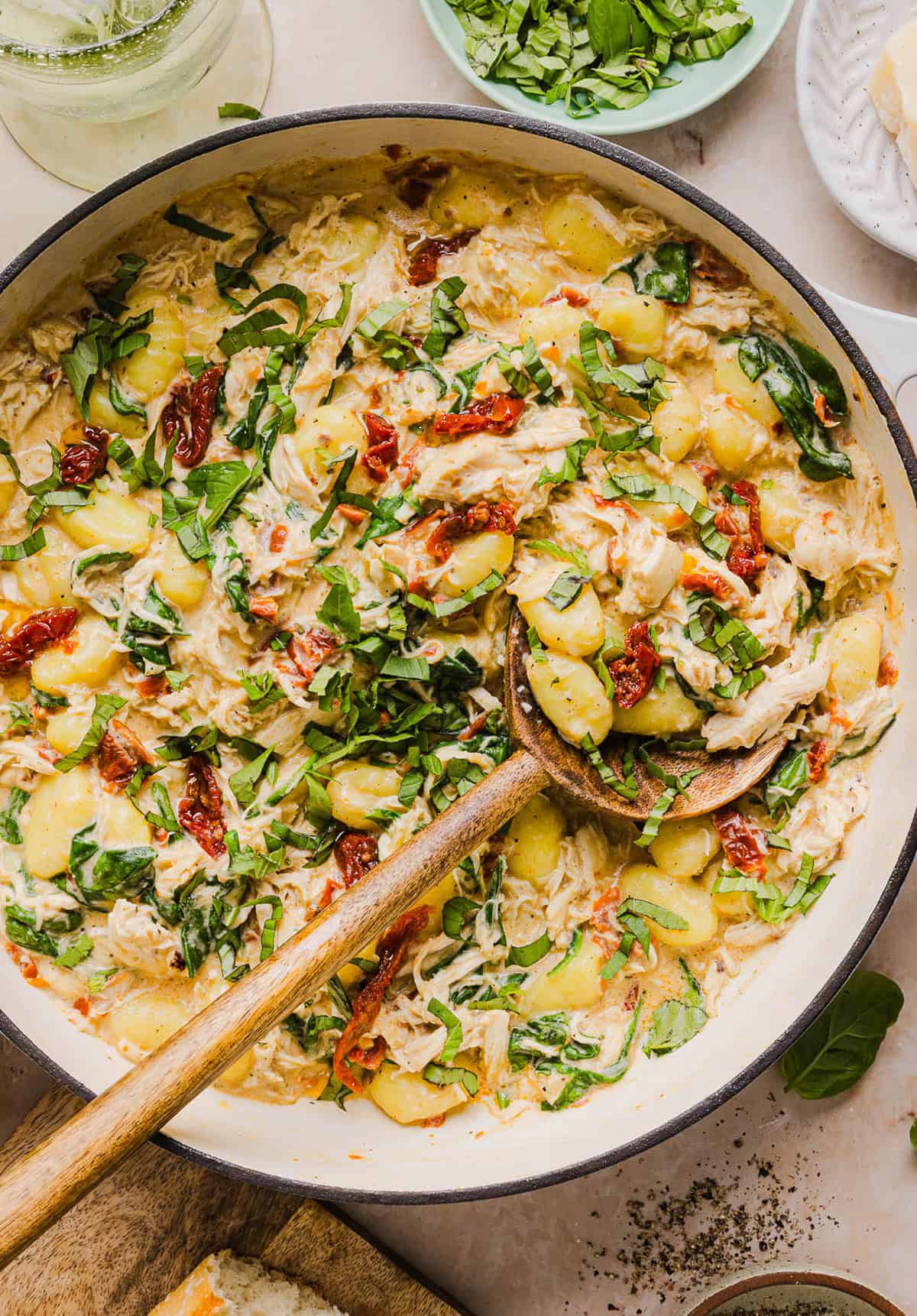 This EASY One Pan Marry Me Chicken and Gnocchi is the perfect weeknight meal! Pillowy soft gnocchi and tender chicken simmered together in a creamy sun dried tomato and parmesan sauce in just 20 minutes!  