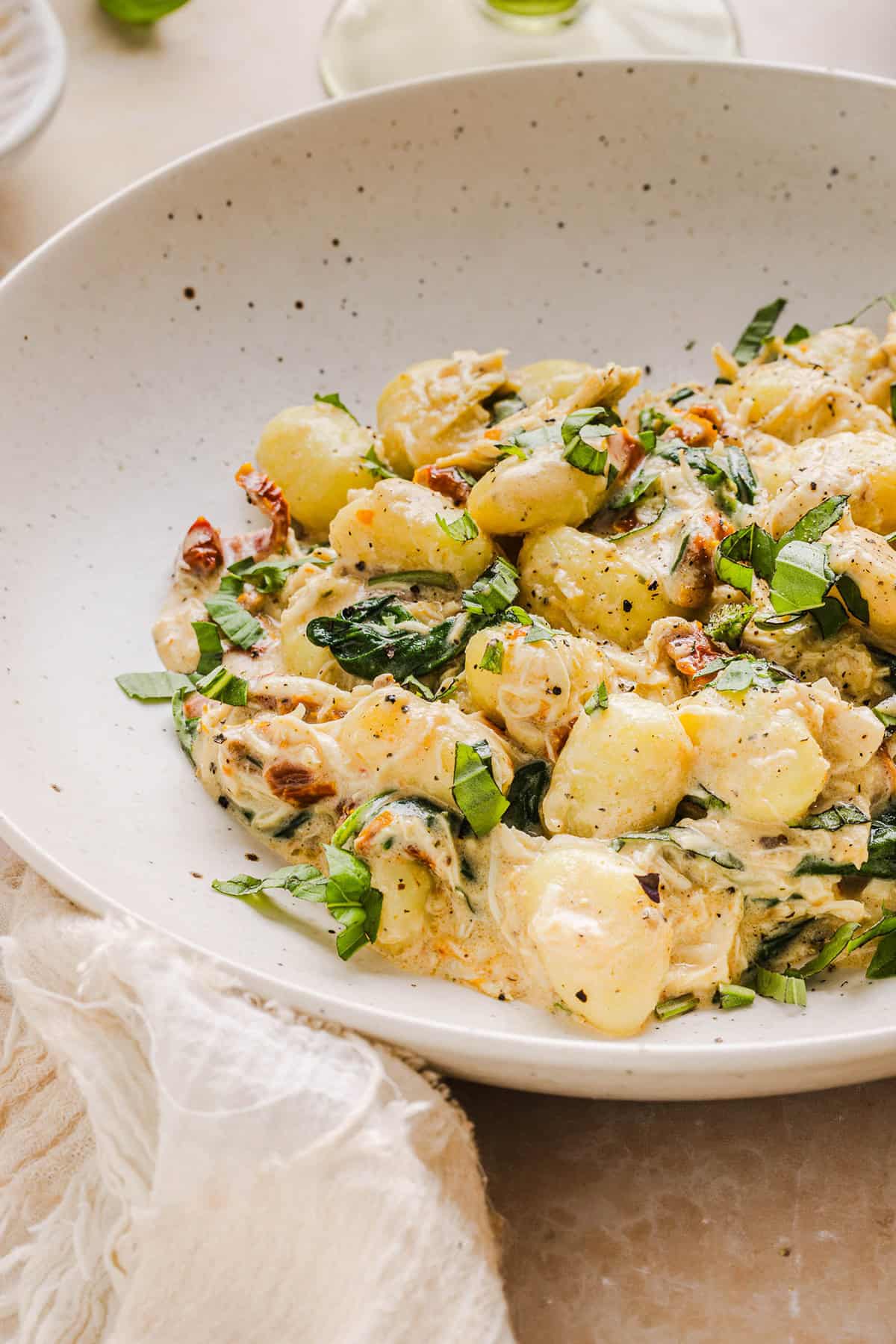 This EASY One Pan Marry Me Chicken and Gnocchi is the perfect weeknight meal! Pillowy soft gnocchi and tender chicken simmered together in a creamy sun dried tomato and parmesan sauce in just 20 minutes!  