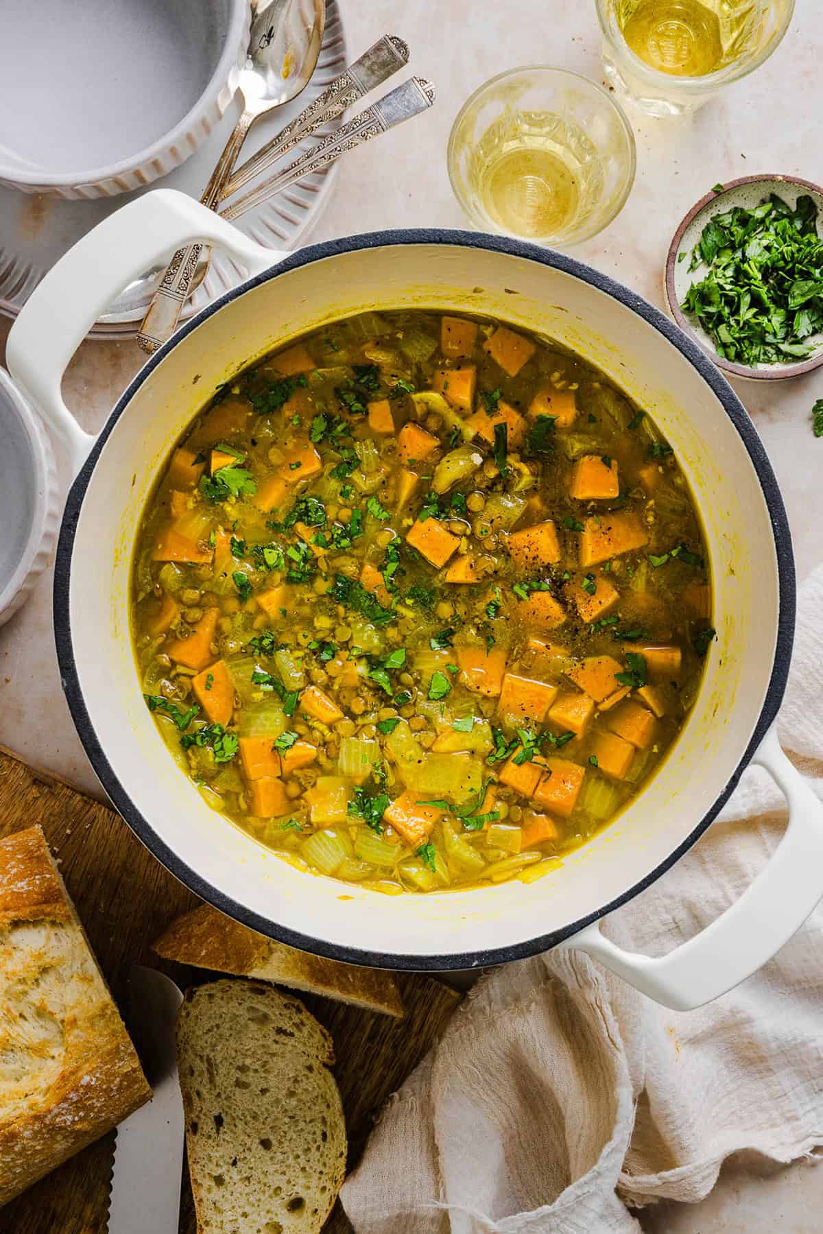 This hearty Lentil and Sweet Potato Stew is is delicious, super filling and easily comes together in under 30 minutes for the perfect weeknight dinner! A nourishing meal made with pantry staples that is gluten-free, dairy-free and vegan.