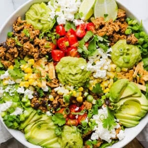 This quick and easy Healthy Taco Salad is made with seasoned ground turkey, fresh veggies and all your favorite toppings to pack in the flavor! Perfect for busy weeknights, meal prep or even serving a crowd!