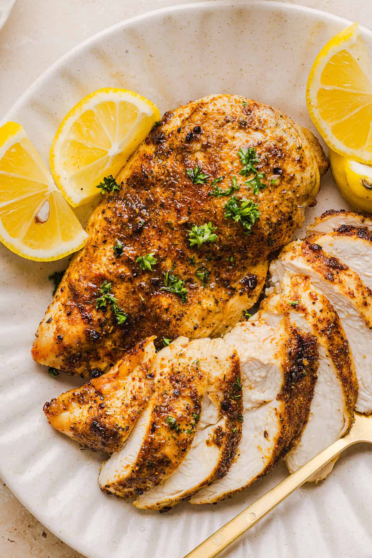 Juicy Air Fryer Chicken Breast recipe that comes out perfectly every time in just 20 minutes! Seasoned with a blend of herbs and spices for a delicious, healthy meal great for busy weeknights or when you need to meal prep.