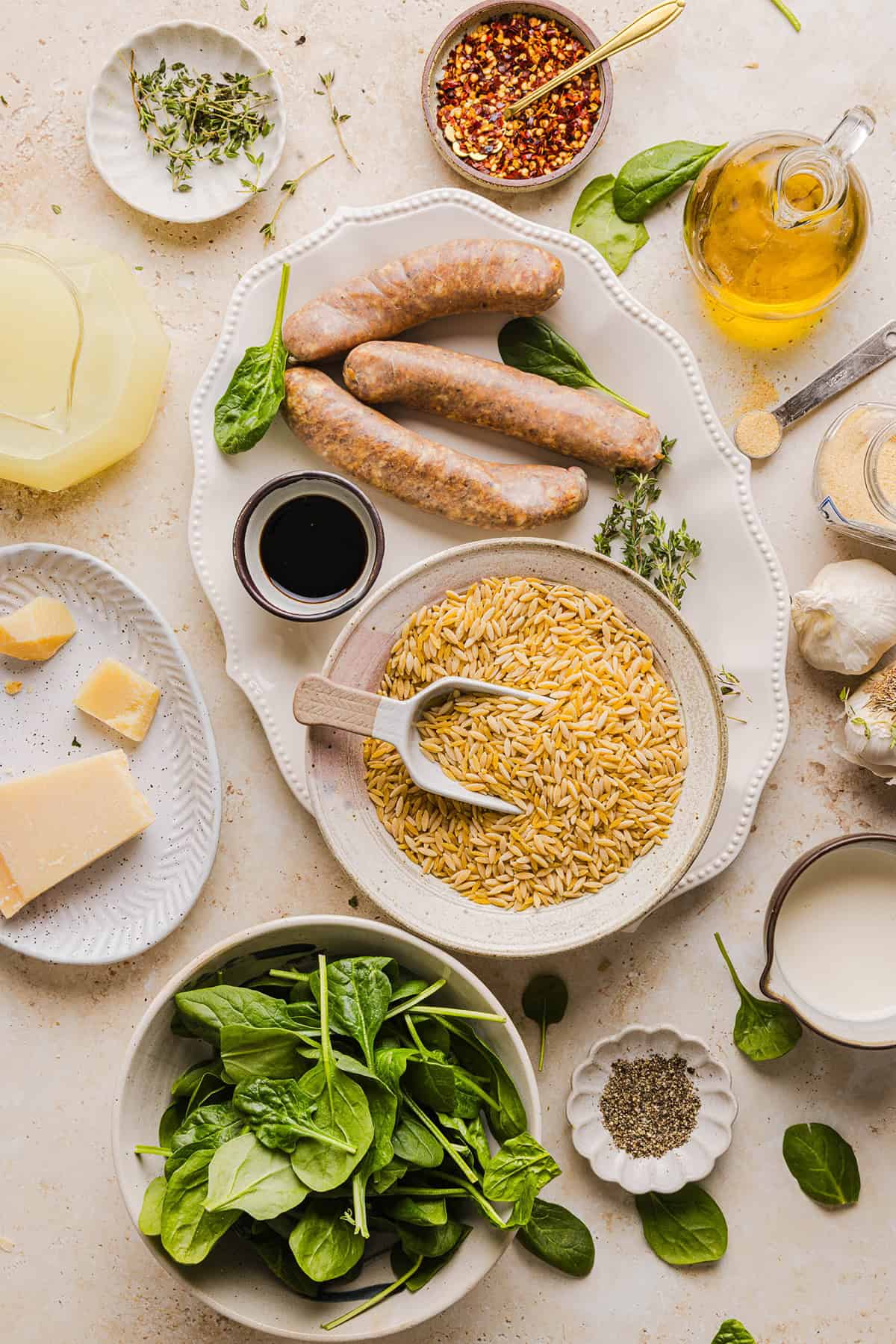 This Creamy Chicken Sausage Orzo Skillet is the perfect weeknight meal loaded with flavorful chicken sausage, tender orzo, tons of garlic and leafy spinach easily made in just 20 minutes all in one pan!  