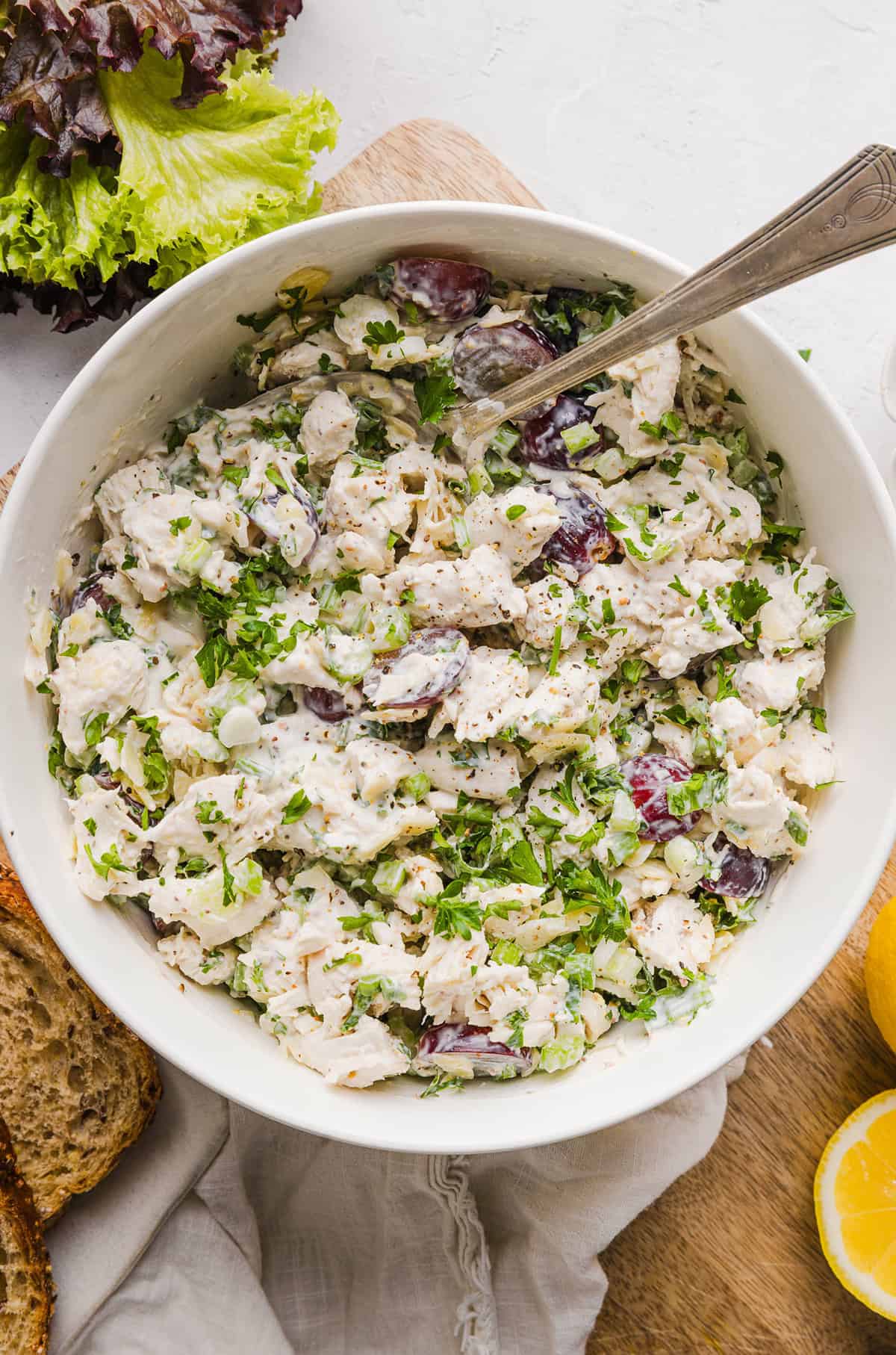 This Healthy Chicken Salad is creamy, fresh and packed with protein! Made with tender chicken, Greek yogurt in place of mayo, crunchy celery, grapes, and sliced almonds for a delicious, easy lunch or meal prep option you'll make on repeat!