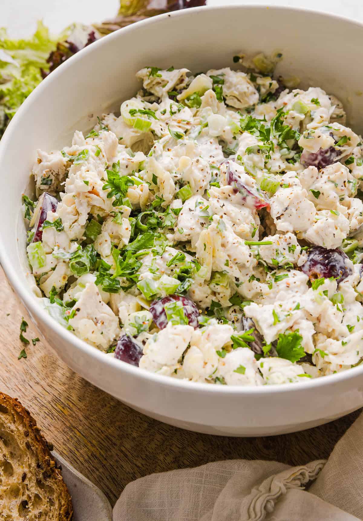 This Healthy Chicken Salad is creamy, fresh and packed with protein! Made with tender chicken, Greek yogurt in place of mayo, crunchy celery, grapes, and sliced almonds for a delicious, easy lunch or meal prep option you'll make on repeat!