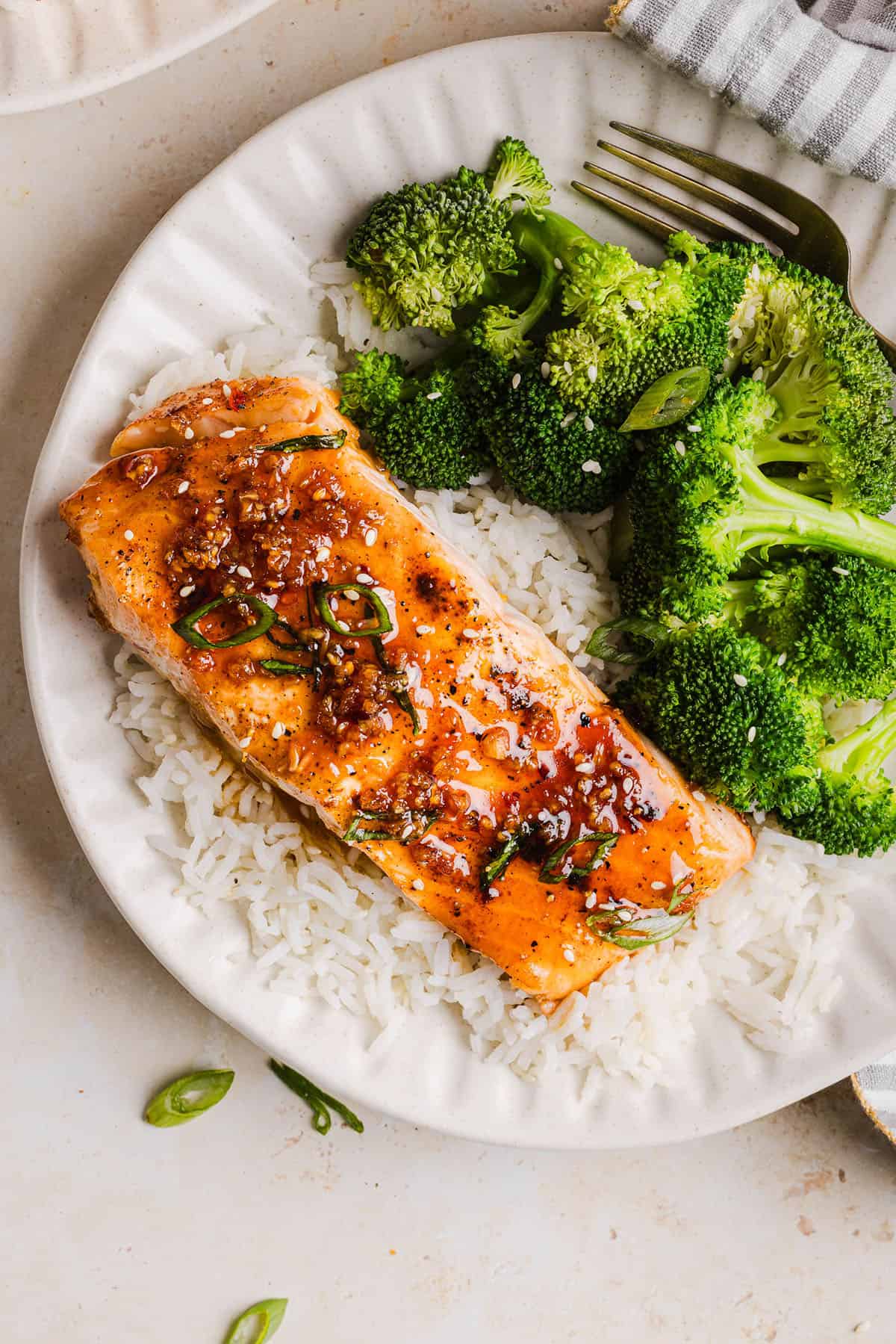 The most flavorful Hot Honey Glazed Salmon that is tender, flaky and coated in a sweet and savory homemade hot honey sauce. This simple healthy recipe easily comes together in under 20 minutes!