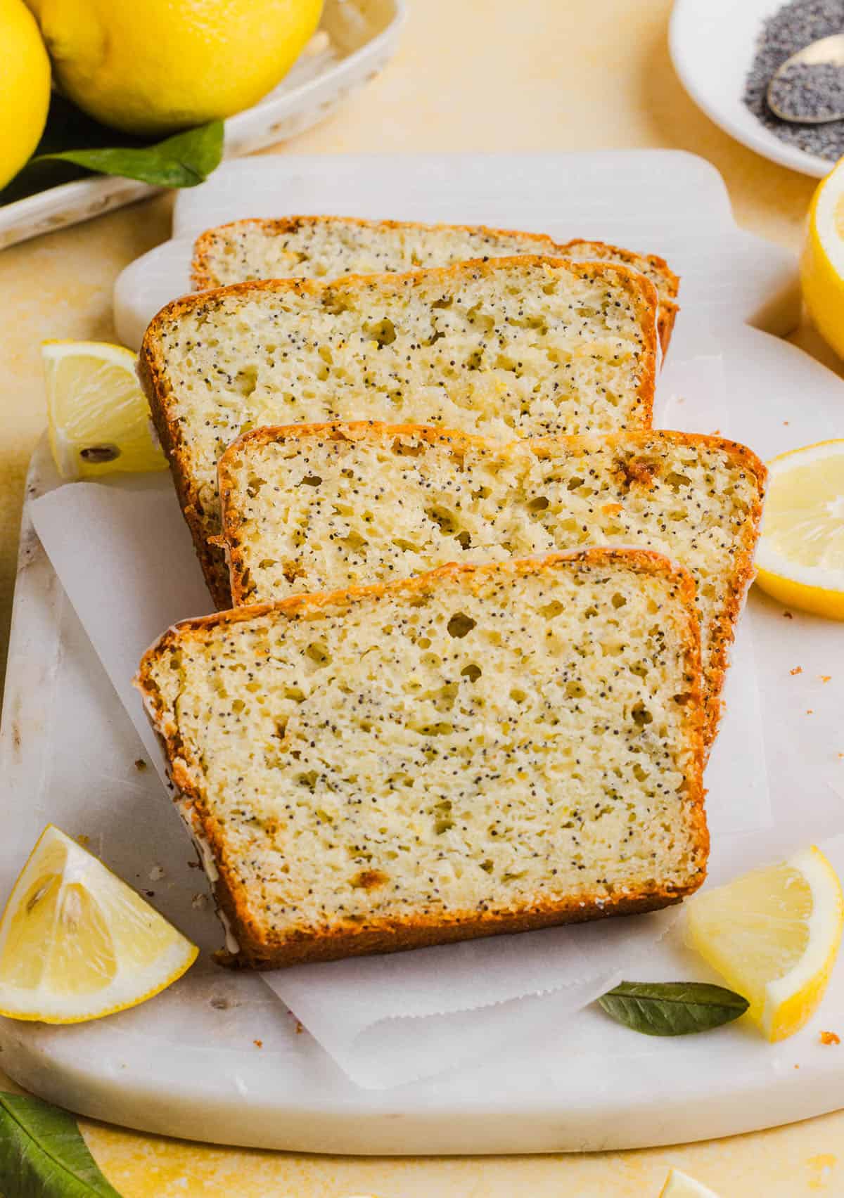 The BEST Healthy Lemon Poppy Seed Bread made with Greek yogurt and honey. Perfectly moist, naturally sweetened, and topped with the most delicious fresh lemon glaze!