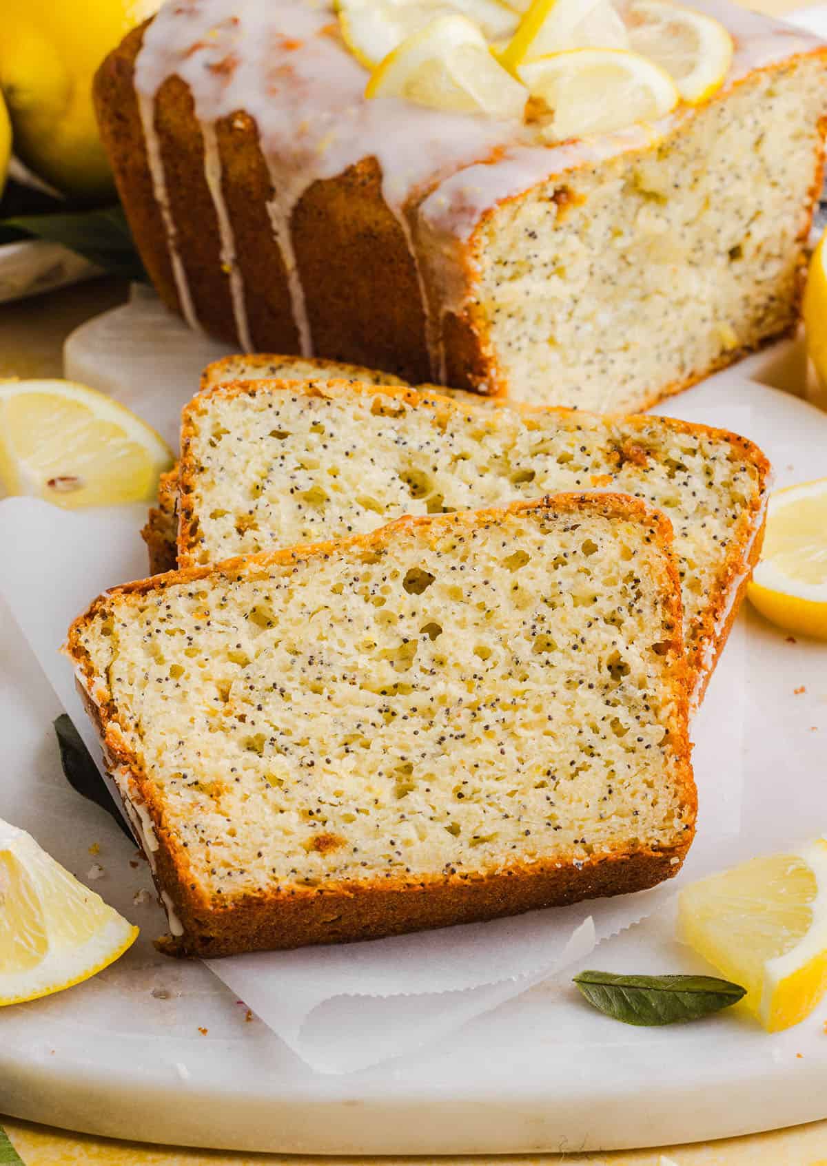 The BEST Healthy Lemon Poppy Seed Bread made with Greek yogurt and honey. Perfectly moist, naturally sweetened, and topped with the most delicious fresh lemon glaze!
