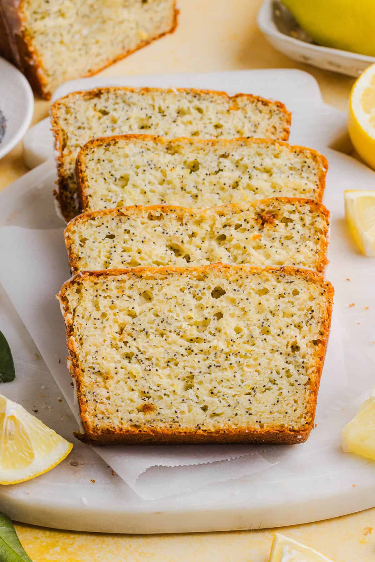 The BEST Healthy Lemon Poppy Seed Bread made with Greek yogurt and honey. Perfectly moist, naturally sweetened, and topped with the most delicious fresh lemon glaze!