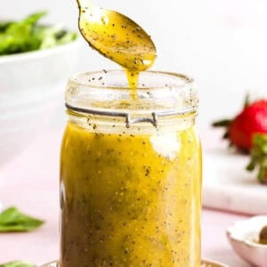 This Poppy Seed Dressing recipe is light, sweet and perfectly tangy made with simple ingredients in just 5 minutes! The perfect addition to fresh salads, fruit, or grilled chicken and tastes so much better than store-bought.
