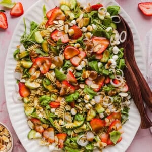 This Strawberry Balsamic Pasta Salad is fresh, flavorful, and perfect for spring and summer! Made with juicy strawberries, tender pasta, fresh basil, creamy mozzarella and crisp cucumbers all tossed in a lightly sweet balsamic dressing.