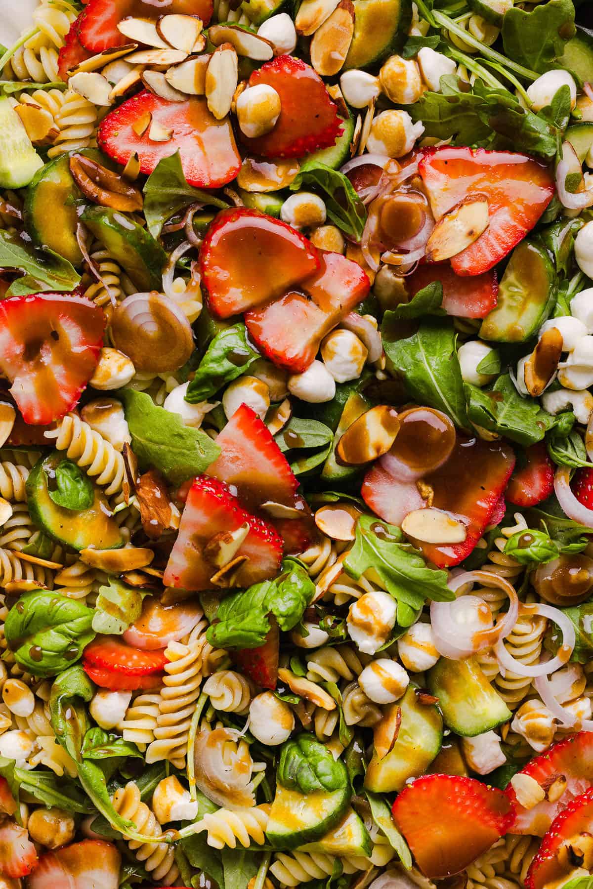 This Strawberry Balsamic Pasta Salad is fresh, flavorful, and perfect for spring and summer! Made with juicy strawberries, tender pasta, fresh basil, creamy mozzarella and crisp cucumbers all tossed in a lightly sweet balsamic dressing. 