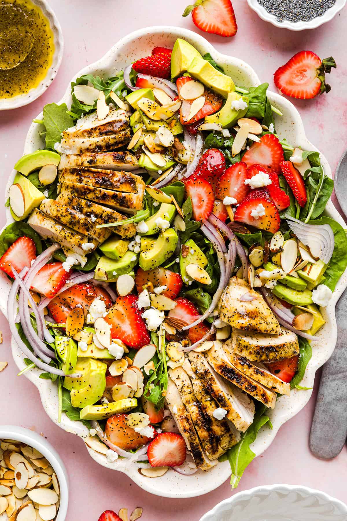 This Strawberry Poppy Seed Chicken Salad is fresh, flavorful, and perfect for spring and summer! Made with juicy strawberries, tender chicken, crunchy toppings, and the BEST poppy seed dressing.