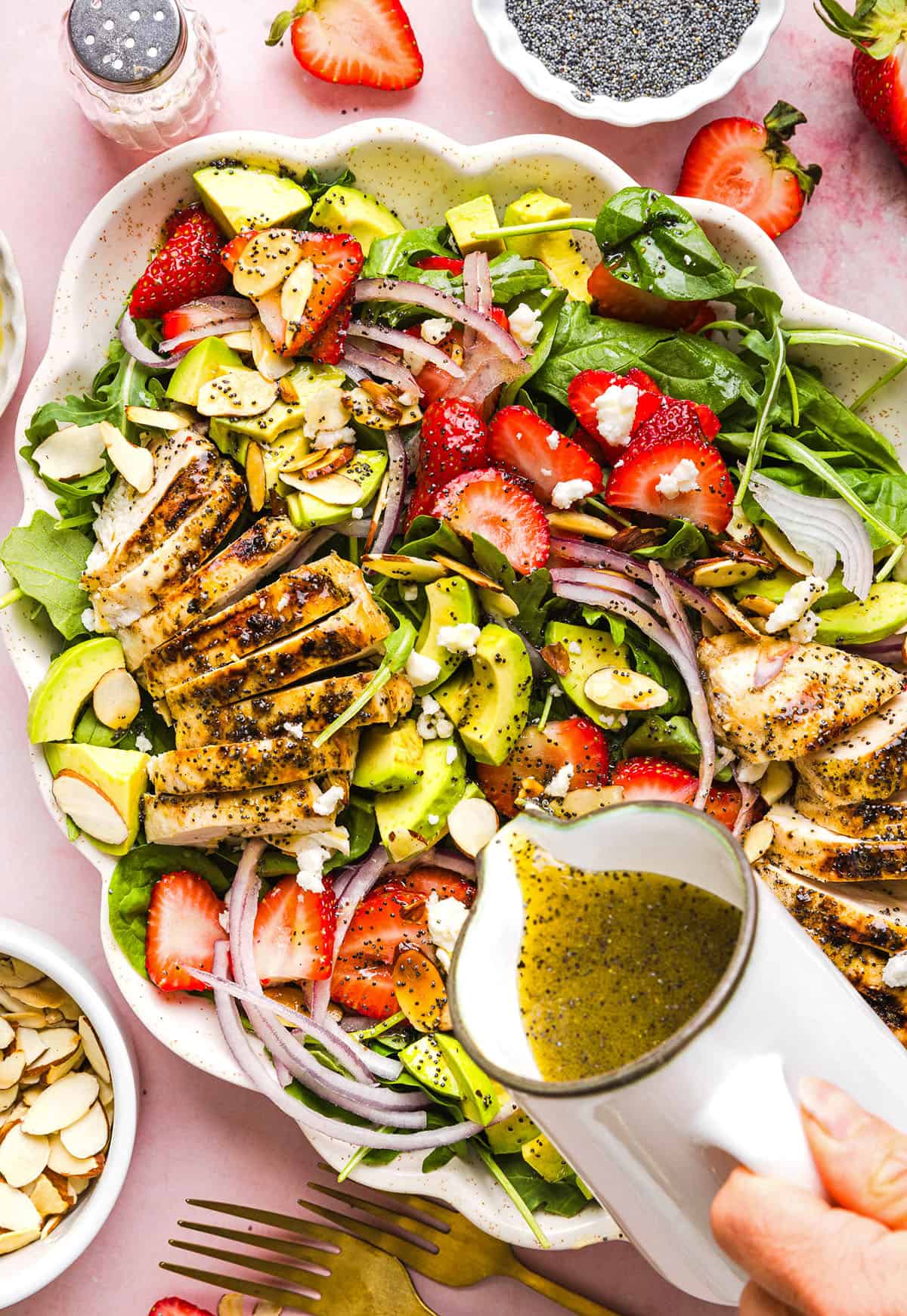 This Strawberry Poppy Seed Chicken Salad is fresh, flavorful, and perfect for spring and summer! Made with juicy strawberries, tender chicken, crunchy toppings, and the BEST poppy seed dressing.