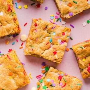 Soft and chewy Healthy Funfetti Cookie Bars that taste like birthday cake batter! Made healthier with whole wheat flour, less butter and zero refined sugar for the perfect lightened-up party dessert!